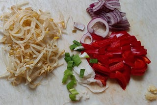Vegetables layed out to make a meal.