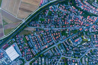 Ariel photo of suburban grids edging farmlands