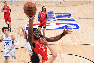 Precious Achiuwa finishing over his defender in the paint