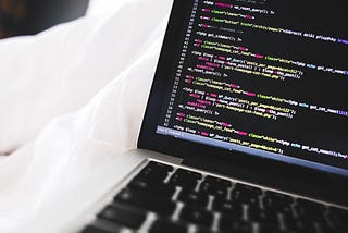 A image of a computer with some programming code