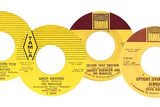 Four yellow labeled 45 RPM records from Tamla Records