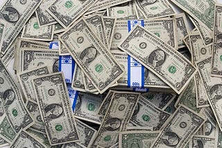 Piles of dollar bills.