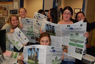 My daughter (second to left) and the staff of her high school paper, 2011