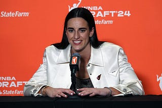 Caitlin Clark answers media questions after being drafted during the 2024 WNBA Draft.