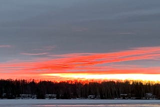 Sunset under clouds above a frozen lake, Wisconsin. IMAGE CREDIT: Laurel Haak