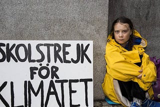 Greta with “School Strike for Climate” banner