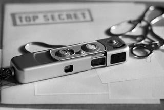 Spy camera and “top secret” stamp