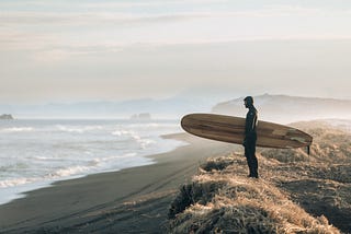 Man holding surfboard