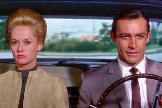 Tippi Hedron and Sean Connery in a car.