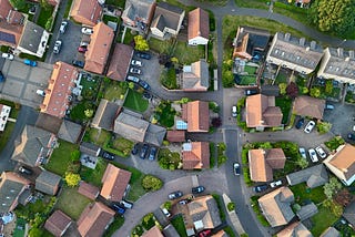 Overhead view of typical British houses in a suburban area, some with solar panels installed