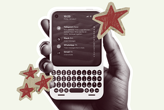 A hand holding a cellphone with a physical keyboard. Decorated with red cutout stars.
