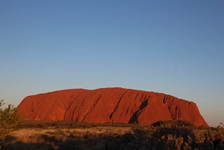 Uluru in the golden hour before sunset.