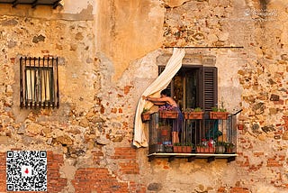 Woman-on-Balcony-at-Sunset-Cefalu-Italy-Copyright-Jean-Huang-Photography.jpg