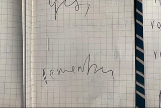 scribbled handwriting in notebook