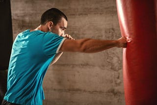 man doing boxing workout at home