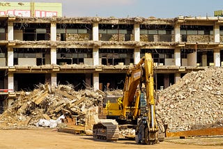 A picture of a bulldozer in a demolition site