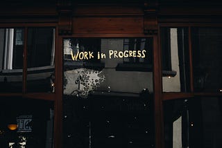 A door with words “work in progress”