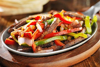 Peppers and onions are companions in the kitchen