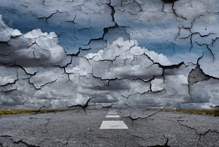 Tattered pieces of sky and ground breaking up in grays and blues