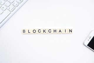 Scrabble pieces showing the word blockchain