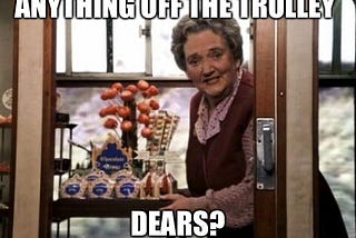 Trolley lady from Harry Potter and the Sorcerer’s (Philosopher’s) Stone film asking “Anything off the trolley dears?” while pushing a cart with magical-inspired sugary candies and treats.