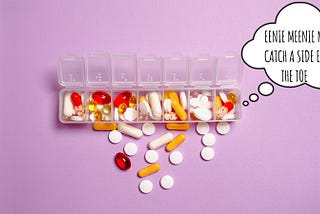pills scattered around a pillbox
