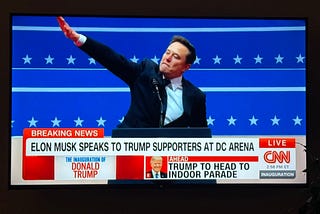 Elon Musk on CNN waving to an appreciative crowd, misconstrued by malefactors as a Nazi salute