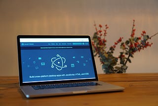 A macbook with the electron website