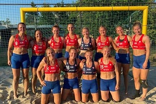 The Norwegian women’s handball team wear blue shorts and red vests
