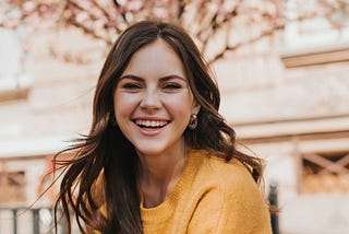 Woman smiling from the joy from doing what she loves