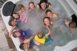 Me with many of my nieces and nephews in April 2006. Nine children (and one neighborhood friend) and none of them mine.