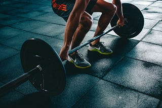 Guy lifting a barbell