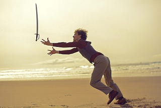 Man dropping his sword on the beach like an idiot