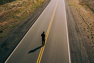 Man Walking on an empty road