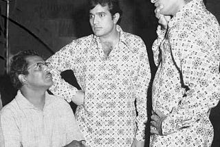 Hrishikesh Mukherjee, Rajesh Khanna, and Amitabh Bachchan captured during the shoot of Namak Haraam.
