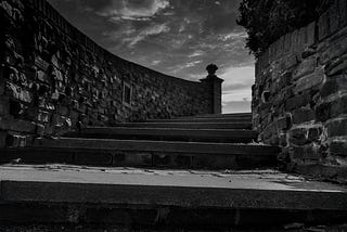 Black and white photo of steps leading to…