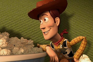 Woody the cowboy sheriff gazing cheerfully at the popcorn