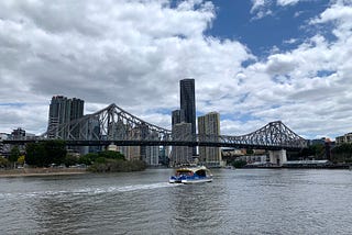 A ferry passing underneath Story Bridge on the Brisbane River.