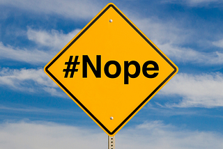 A road sign that says hashtag nope