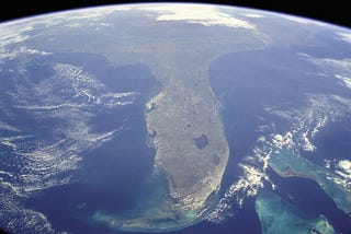 From above Cuba, this photo shows an oblique, foreshortened view of the Florida Peninsula & the curvature of Earth from space