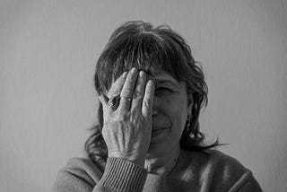 Black and white photo of a woman who is worried