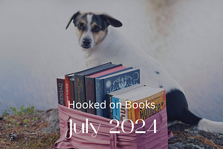 A dog sitting behind a stack of books