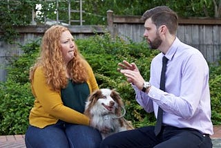 Mike Schmidt speaking with a woman and her dog