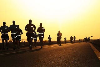Source: https://www.wallpaperflare.com/people-running-on-road-during-daytime-runners-silhouettes-dusk-wallpaper-whyhx