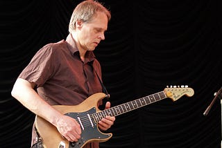 Tom Verlaine playing guitar