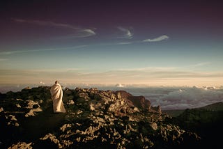 Monk on top of mountain