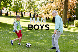 young boy soccer with older man like dad or gr
