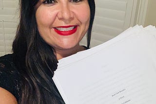 Picture of the author with her book baby.