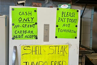 Signs on fridge in the diner
