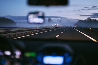 inside a car looking out over the road